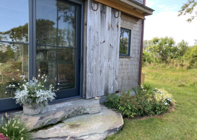 Landscaping With Bluestone Stairs and Salvaged Barn Door